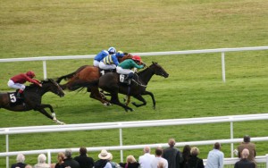 Tasleet (far side) the winner of the Rose Bowl Stakes
