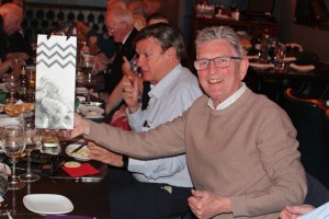 Des Young with winning bottle of Champagne