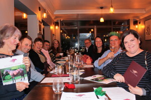 Owners enjoying good food, wine and company
