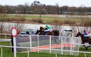 Chambord (nearside) & Storm Arising jumping in the three-runner handicap chase