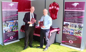 Simon Double with Solario Racing owner, David Gibbon on the trade stand