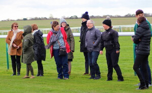 June and owners sharing a joke with Amy Murphy on the gallops